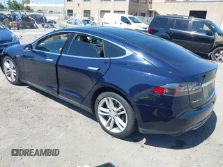 2014 Tesla Model S 60 with VIN 5YJSA1H12EFP46760, listed as a IAAI auction lot 42344596 with 106,252 mi miles and . Bid and sale history available at DreamBid. Image 3.