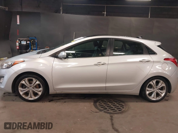 2013 Hyundai Elantra GT with VIN KMHD35LE2DU105677, listed as a IAAI auction lot 42027623 with 137,063 mi miles. Bid and sale history available at carsss.com. Image 14.