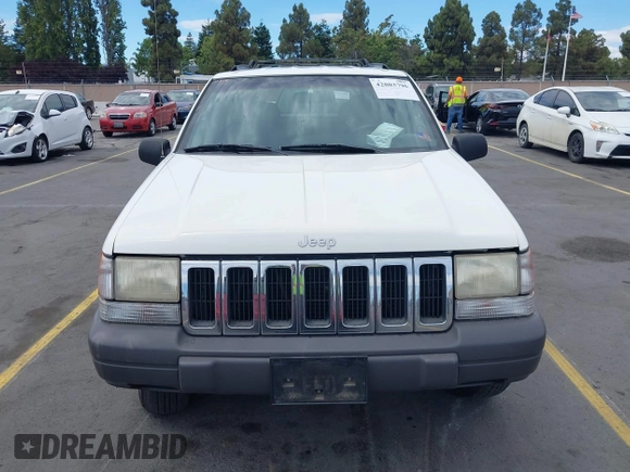 1996 Jeep Grand Cherokee Laredo with VIN 1J4FX58S5TC388512, listed as a IAAI auction lot 42803796 with 147,732 mi miles and . Bid and sale history available at DreamBid. Image 6.