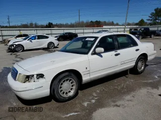 2000 Ford Crown Victoria LX z VIN 2FAFP74W9YX187500, wystawiony jako Copart lot #48859675 z przebiegiem 161 964 mil mil oraz Szkoda całkowita • Salvage title. Historia ofert i sprzedaży dostępna na DreamBid. Obrazek 1.