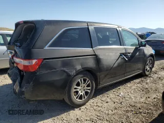 2012 Honda Odyssey EX-L with VIN 5FNRL5H69CB141594, listed as a Copart auction lot 55422115 with 181,745 mi miles and Salvage Title. Bid and sale history available at DreamBid. Image 3.