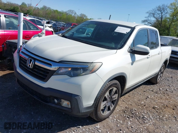 2017 Honda Ridgeline RTL with VIN 5FPYK2F55HB002455, listed as a IAAI auction lot 42032551 with 115,178 mi miles and . Bid and sale history available at DreamBid. Image 2.