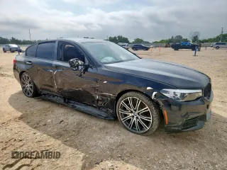 2018 BMW 5 Series 540i xDrive with VIN WBAJE7C52JWD52730, listed as a Copart auction lot 60297425 with 104,208 mi miles and Salvage title. Bid and sale history available at DreamBid. Image 4.