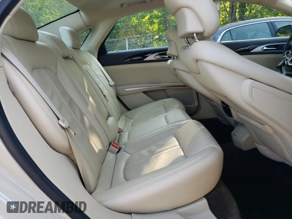 2015 Lincoln MKZ z VIN 3LN6L2JK4FR629312, wystawiony jako Copart lot #60230405 z przebiegiem 79 570 mil mil oraz Szkoda całkowita • Salvage title. Historia ofert i sprzedaży dostępna na DreamBid. Obrazek 10.