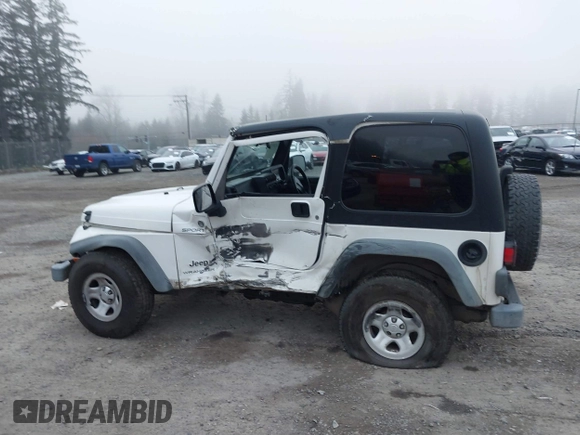 2006 Jeep Wrangler Sport Right Hand Drive with VIN 1J4F449S16P709895, listed as a IAAI auction lot 41349311 with 157,125 mi miles. Bid and sale history available at carsss.com. Image 14.