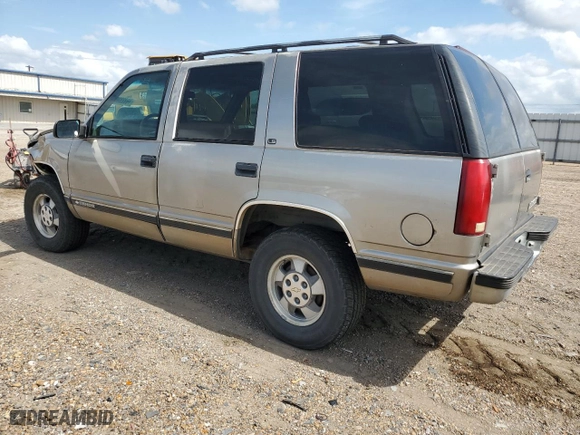 1999 Chevrolet Tahoe Z71 with VIN 1GNEK13R0XJ444734, listed as a Copart auction lot 76323384 with 160,631 mi miles and Salvage Title. Bid and sale history available at carsss.com. Image 2.