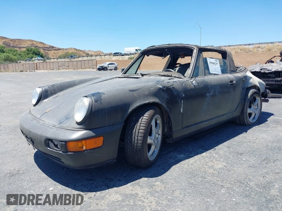 1988 Porsche 911 z VIN WP0EB0917JS161351, wystawiony jako IAAI lot #39908257 z przebiegiem Nie podano mil oraz . Historia ofert i sprzedaży dostępna na DreamBid. Obrazek 2.