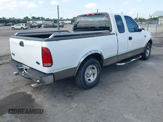 2002 Ford F-150 XL with VIN 1FTRX17242NA69697, listed as a IAAI auction lot 42038258 with 207,008 mi miles. Bid and sale history available at carsss.com. Image 4.