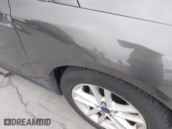 2015 Ford Focus SE with VIN 1FADP3F29FL342311, listed as a IAAI auction lot 42109683 with 70,579 mi miles. Bid and sale history available at carsss.com. Image 6.