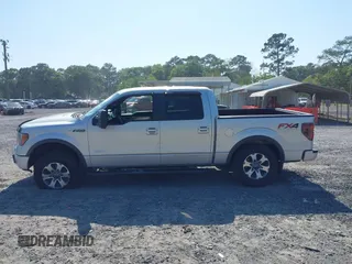 2013 Ford F-150 XL with VIN 1FTFW1ET0DFC85741, listed as a IAAI auction lot 42022221 with 156,509 mi miles. Bid and sale history available at carsss.com. Image 14.