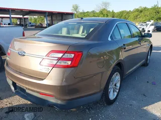 2015 Ford Taurus SEL z VIN 1FAHP2E84FG125243, wystawiony jako IAAI lot #42045847 z przebiegiem 42 093 mil mil oraz . Historia ofert i sprzedaży dostępna na DreamBid. Obrazek 4.