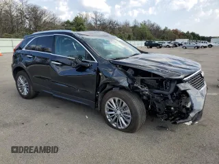 2024 Cadillac XT4 AWD Premium Luxury with VIN 1GYFZDR49RF112460, listed as a Copart auction lot 67183524 with 12,396 mi miles and Salvage title. Bid and sale history available at DreamBid. Image 4.