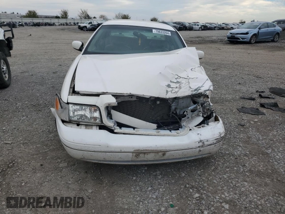 2000 Ford Crown Victoria LX z VIN 2FAFP74W4YX120352, wystawiony jako Copart lot #79833264 z przebiegiem Nie podano mil oraz Szkoda całkowita • Salvage title. Historia ofert i sprzedaży dostępna na DreamBid. Obrazek 5.