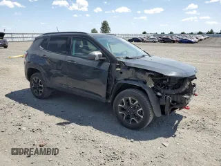 2018 Jeep Compass Trailhawk with VIN 3C4NJDDBXJT484835, listed as a Copart auction lot 61542415 with 59,389 mi miles and Salvage title. Bid and sale history available at DreamBid. Image 4.