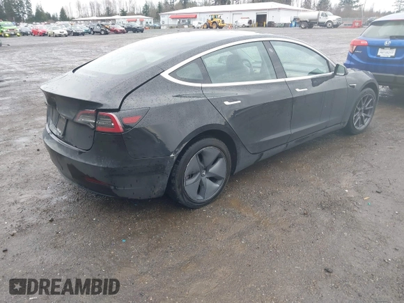 2019 Tesla Model 3 Mid Range with VIN 5YJ3E1EAXKF296378, listed as a IAAI auction lot 41739616 with 77,100 mi miles and . Bid and sale history available at DreamBid. Image 4.