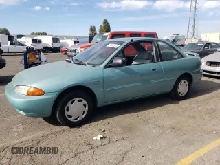 1994 Plymouth Colt z VIN JP3EA21A8RU055081, wystawiony jako Copart lot #77993974 z przebiegiem 77 110 mil mil oraz Czysty tytuł • Clean title. Historia ofert i sprzedaży dostępna na DreamBid. Obrazek 1.