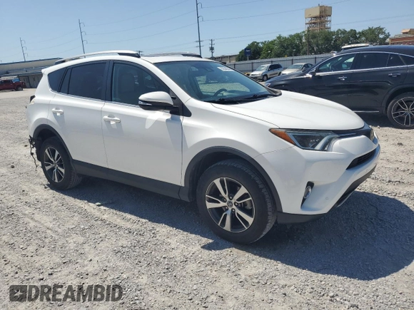 2018 Toyota RAV4 XLE with VIN 2T3WFREV7JW512949, listed as a Copart auction lot 52546345 with 41,558 mi miles and Salvage Title. Bid and sale history available at DreamBid. Image 4.