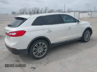2016 Lincoln MKX Reserve with VIN 2LMPJ6LP8GBL33580, listed as a IAAI auction lot 41749632 with 100,579 mi miles. Bid and sale history available at carsss.com. Image 4.