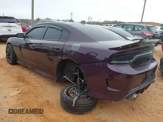 2021 Dodge Charger Scat Pack Widebody with VIN 2C3CDXGJ5MH579324, listed as a IAAI auction lot 41399676 with 77,156 mi miles and . Bid and sale history available at DreamBid. Image 3.