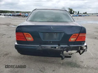 1997 Mercedes-Benz E-Class with VIN WDBJF55F4VJ025769, listed as a Copart auction lot 73460164 with 0 mi miles and Salvage Title. Bid and sale history available at carsss.com. Image 6.