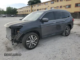 2017 Honda Pilot Touring with VIN 5FNYF5H94HB011565, listed as a Copart auction lot 63282635 with 130,872 mi miles and Salvage title. Bid and sale history available at DreamBid. Image 1.