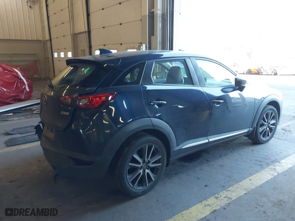 2018 Mazda CX-3 Grand Touring with VIN JM1DKFD77J0300612, listed as a IAAI auction lot 41322923 with 49,830 mi miles. Bid and sale history available at carsss.com. Image 4.