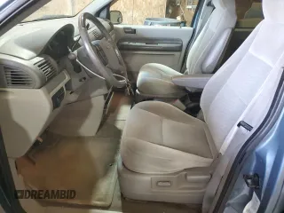 2005 Ford Freestar SES z VIN 2FMZA57685BA52313, wystawiony jako Copart lot #57564685 z przebiegiem 174 302 mil mil oraz Szkody całkowita. Historia ofert i sprzedaży dostępna na DreamBid. Obrazek 7.