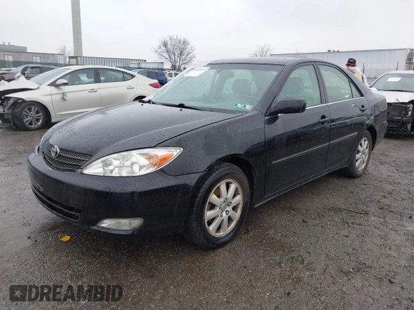2003 Toyota Camry LE with VIN 4T1BE30K13U144114, listed as a IAAI auction lot 41829879 with 60,385 mi miles and . Bid and sale history available at DreamBid. Image 2.