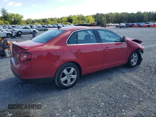 2009 Volkswagen Jetta SE with VIN 3VWRZ71K69M177746, listed as a Copart auction lot 70990074 with 128,390 mi miles and Salvage title. Bid and sale history available at DreamBid. Image 3.