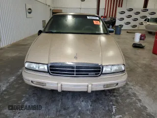 1993 Buick Regal Custom with VIN 2G4WB54L4P1411904, listed as a Copart auction lot 56564455 with 112,248 mi miles and Salvage title. Bid and sale history available at DreamBid. Image 5.