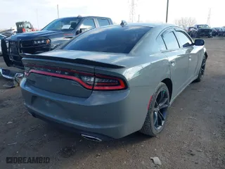 2017 Dodge Charger SXT with VIN 2C3CDXHG5HH557283, listed as a IAAI auction lot 41145254 with NaN miles. Bid and sale history available at carsss.com. Image 4.