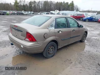2003 Ford Focus LX with VIN 1FAFP33P33W267575, listed as a IAAI auction lot 41804406 with 106,957 mi miles and . Bid and sale history available at carsss.com. Image 4.