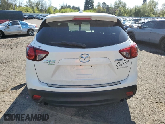 2014 Mazda CX-5 Grand Touring with VIN JM3KE4DY2E0354795, listed as a Copart auction lot 54205775 with 62,939 mi miles and Salvage Title. Bid and sale history available at DreamBid. Image 6.