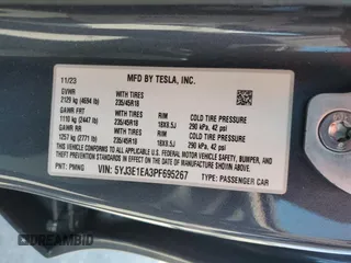 2023 Tesla Model 3 with VIN 5YJ3E1EA3PF695267, listed as a Copart auction lot 52559645 with 9,025 mi miles and Salvage title. Bid and sale history available at DreamBid. Image 13.