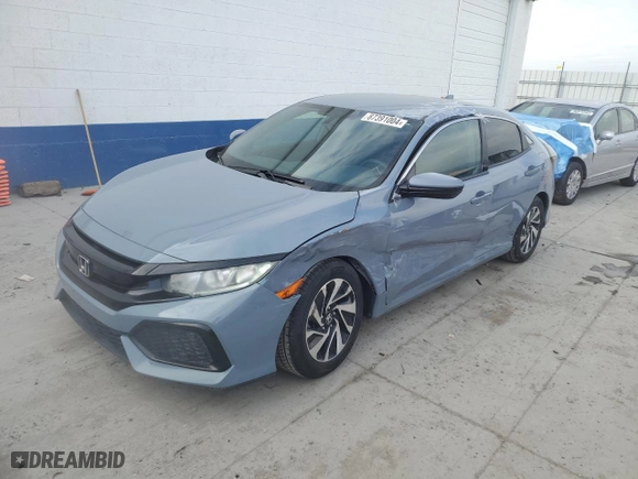 2017 Honda Civic Hatchback LX with VIN SHHFK7H29HU212765, listed as a Copart auction lot 87391004 with 74,299 mi miles and Salvage Title. Bid and sale history available at carsss.com. Image 1.