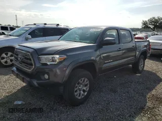 2016 Toyota Tacoma SR5 with VIN 5TFAX5GN1GX061017, listed as a Copart auction lot 61743905 with 157,918 mi miles and Salvage title. Bid and sale history available at DreamBid. Image 1.