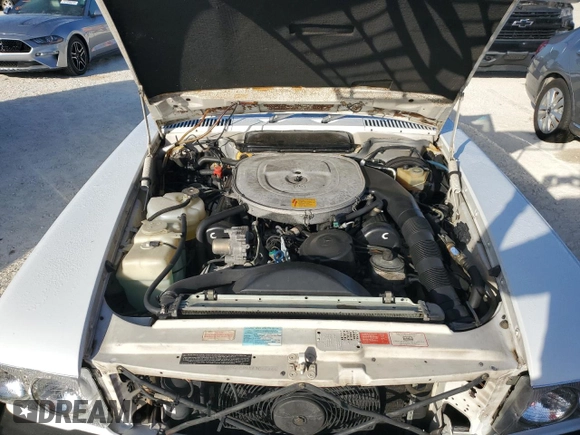 1989 Mercedes-Benz 560 SL с VIN WDBBA48D4KA104474, выставлен на аукционе Copart как лот 76584374 с пробегом 118 252 миль миль и Списание • Salvage title. История ставок и продаж доступна на DreamBid. Изображение 11.