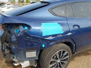 2023 BMW X6 xDrive40i z VIN 5UXCY6C07P9P85707, wystawiony jako IAAI lot #42075043 z przebiegiem 25 218 mil mil oraz . Historia ofert i sprzedaży dostępna na DreamBid. Obrazek 19.