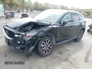 2018 Mazda CX-5 Grand Touring with VIN JM3KFBDM1J0358197, listed as a IAAI auction lot 41967940 with 148,119 mi miles and . Bid and sale history available at DreamBid. Image 2.