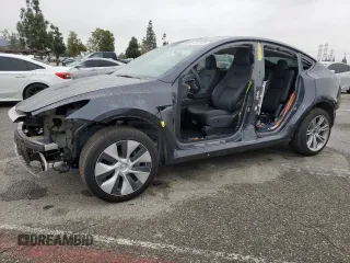 2024 Tesla Model Y with VIN 7SAYGDED5RF093410, listed as a Copart auction lot 50557225 with 6,396 mi miles and Salvage Title. Bid and sale history available at DreamBid. Image 1.