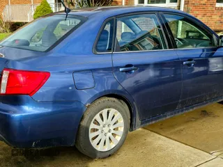 2011 Subaru Impreza Premium with VIN JF1GE6B69BH513147, listed as a Copart auction lot 52942885 with 156,500 mi miles and Clean title. Bid and sale history available at DreamBid. Image 4.