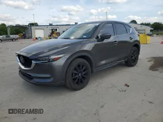 2018 Mazda CX-5 Grand Touring z VIN JM3KFADM1J1399482, wystawiony jako Copart lot #56002525 z przebiegiem 144 811 mil mil oraz Szkoda całkowita • Salvage title. Historia ofert i sprzedaży dostępna na DreamBid. Obrazek 1.