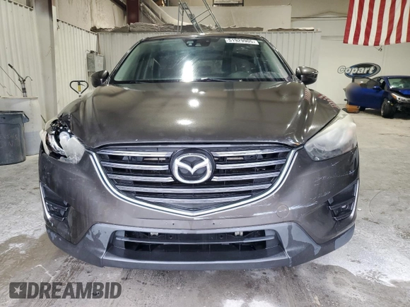2016 Mazda CX-5 Grand Touring z VIN JM3KE2DY5G0821683, wystawiony jako Copart lot #51929905 z przebiegiem 119 392 mil mil oraz Czysty tytuł • Clean title. Historia ofert i sprzedaży dostępna na DreamBid. Obrazek 5.