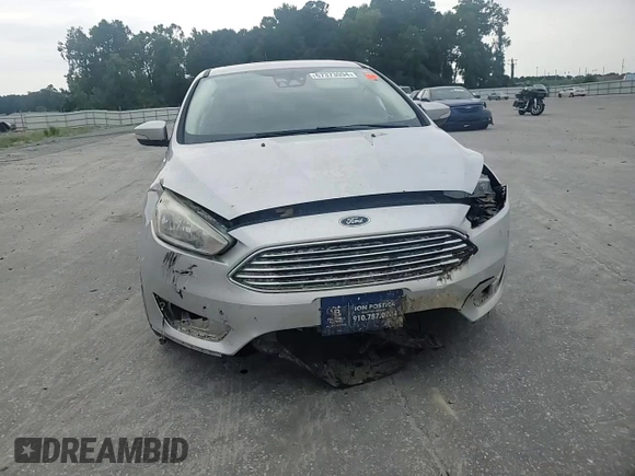 2017 Ford Focus Titanium with VIN 1FADP3N27HL251297, listed as a Copart auction lot 67373094 with 104,733 mi miles and Salvage Title. Bid and sale history available at carsss.com. Image 11.