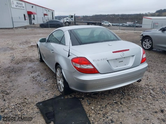 2005 Mercedes-Benz SLK-Class with VIN WDBWK56FX5F075529, listed as a IAAI auction lot 41535391 with 104,792 mi miles. Bid and sale history available at carsss.com. Image 3.