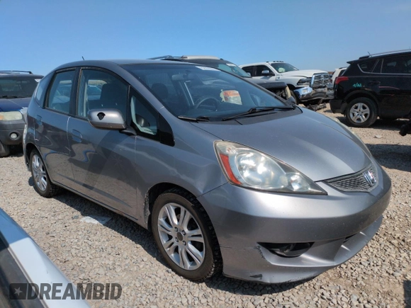 2010 Honda Fit Sport with VIN JHMGE8H41AC002070, listed as a Copart auction lot 62356565 with 148,279 mi miles and Salvage title. Bid and sale history available at DreamBid. Image 4.