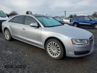 2015 Audi A8 3.0T z VIN WAU3GAFD7FN008548, wystawiony jako Copart lot #50428525 z przebiegiem 128 457 mil mil oraz Czysty tytuł • Clean title. Historia ofert i sprzedaży dostępna na DreamBid. Obrazek 4.
