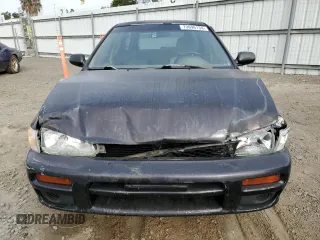 1998 Subaru Impreza L with VIN JF1GF4354WG805257, listed as a Copart auction lot 73696134 with 141,441 mi miles and Salvage title. Bid and sale history available at DreamBid. Image 5.