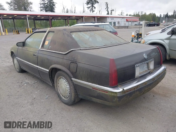 1992 Cadillac Eldorado z VIN 1G6EL13B0NU605624, wystawiony jako IAAI lot #42127549 z przebiegiem Nie podano mil oraz . Historia ofert i sprzedaży dostępna na DreamBid. Obrazek 3.