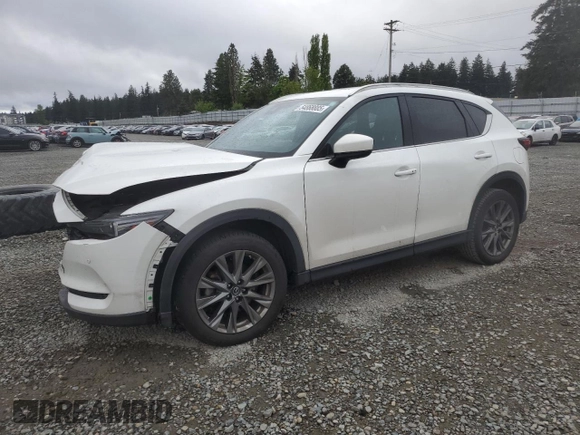 2021 Mazda CX-5 Signature with VIN JM3KFBEY3M0410998, listed as a Copart auction lot 54868885 with 73,207 mi miles and Salvage Title. Bid and sale history available at carsss.com. Image 1.